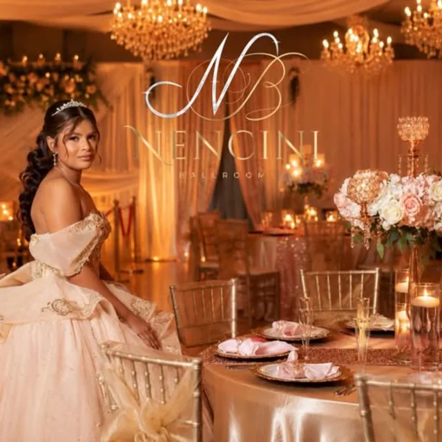 Quinceañera beside a warm ballroom tablescape